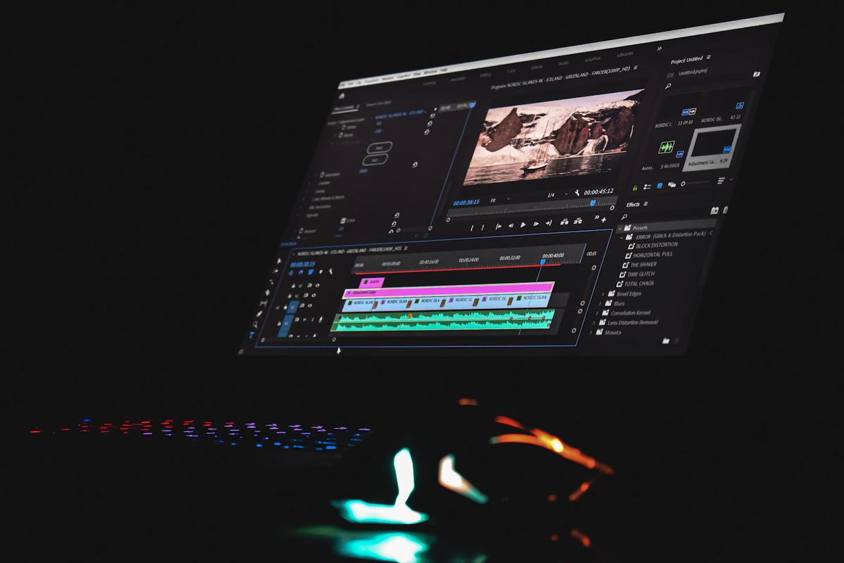 A monitor showing video editing software with a timeline and preview window